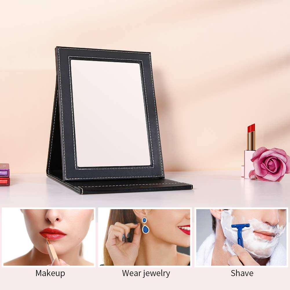 Large travel mirror standing on a dresser