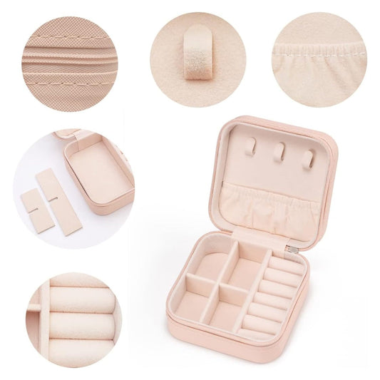 Small pink travel jewelry case open, showing ring rolls and earring slots