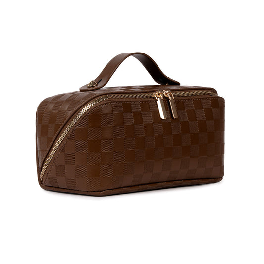 Brown checked travel makeup bag with gold zipper, angled view