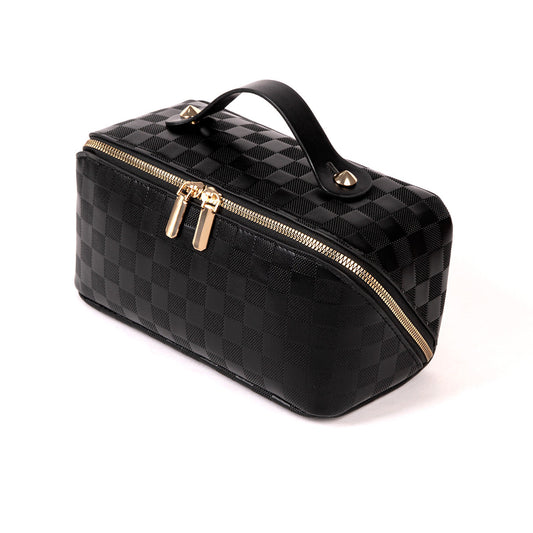 Black checked travel makeup bag with gold zipper, angled view